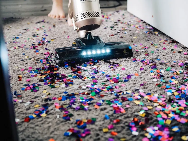 Vacuuming a carpeted floor