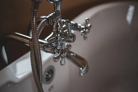 Chrome plumbing fixture close-up
