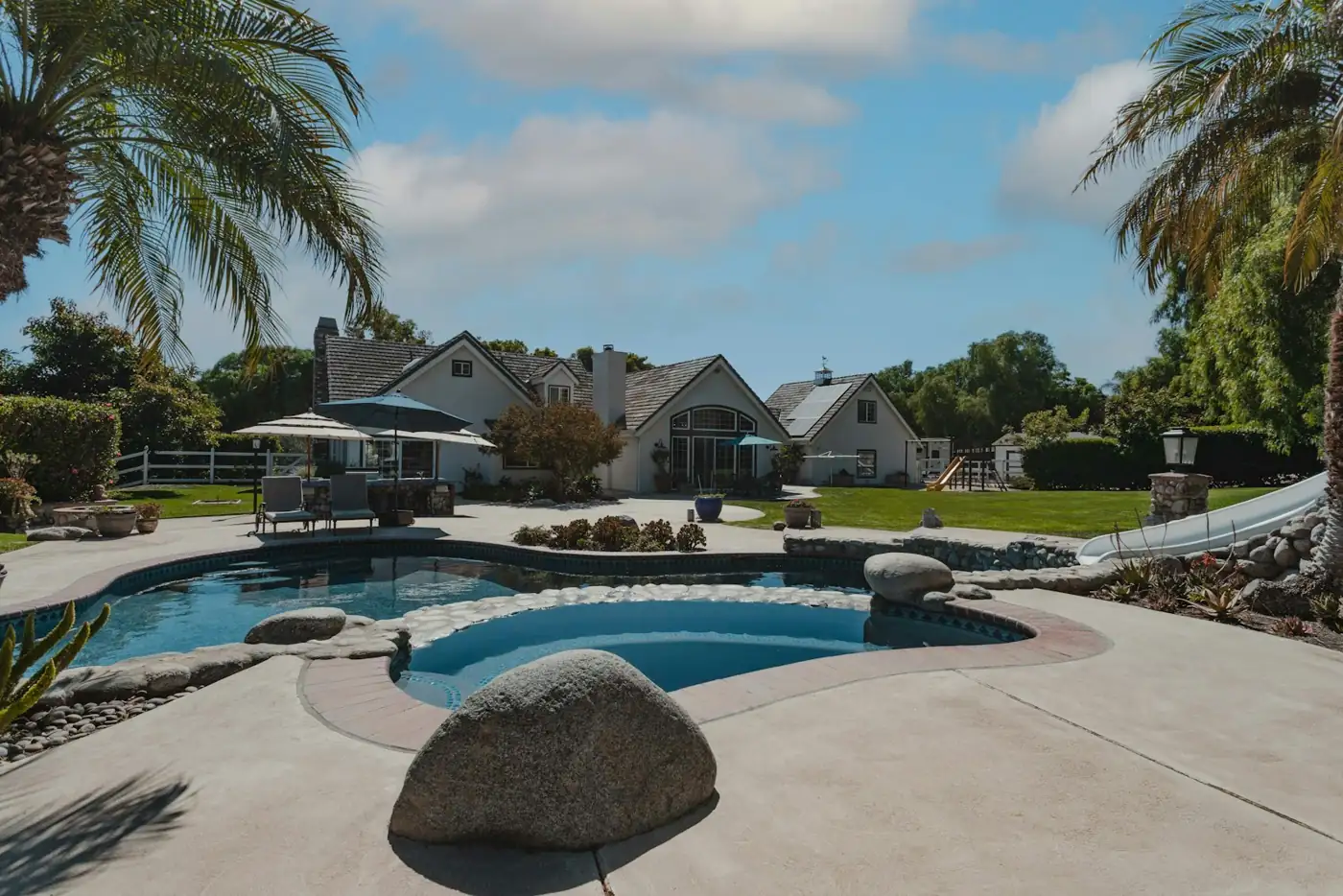 A residential backyard swimming pool — pool service