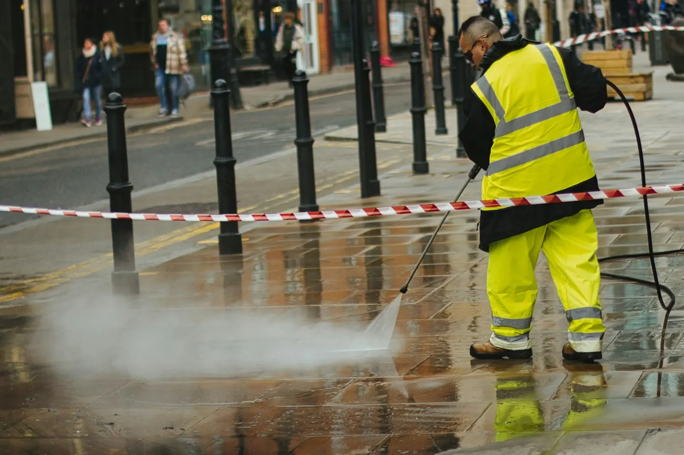 A pressure washing crew at work — the kind of home-service business ARKHOS runs